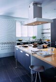 Simple fitted kitchen with designer kitchen island