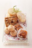Assorted cookies on a glass tray