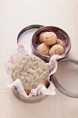 Poppy seed cookies and peanut cookies in a cookie tin