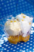 Vanilla ice cream with mango puree, coconut and cream