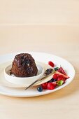 Baked chocolate-nut pudding with berries