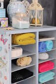 Colorful hand towels in a half-high bookcase