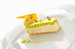 Vanilla parfait with rum and raisin ice cream, crunchy pistachios and frothy pistachio mousse