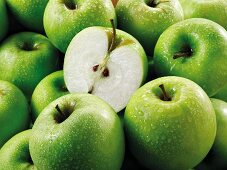 Granny Smith apples, whole and halves(fills the screen)