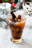 A Christmas drink with dried fruit and cinammon