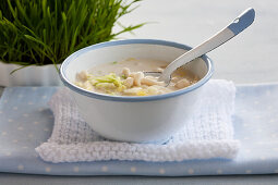 Creamy soup with enoki mushrooms