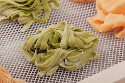 Pasta nests drying on a rack