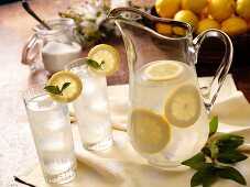 Pitcher and Two Glasses of Lemonade; Sugar Jar and Basket of Lemons