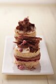 Chocolate tartlets with cream and redcurrants