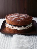 Chocolate cake with a cream and cherry filling
