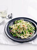 Linguine with peas, ricotta and diced bacon