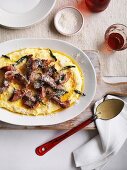 Veal escalope with ham and sage on polenta