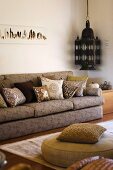 Living room with upholstered furniture and an antique, Moroccan style lantern