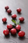 Cranberries on a slate surface