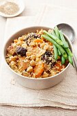 Couscous with pork, chickpeas, carrots and prunes