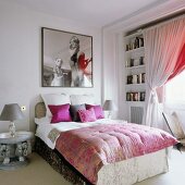 Mixture of styles in bedroom with large, square photo on wall