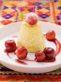 Couscous and saffron cream with cherries