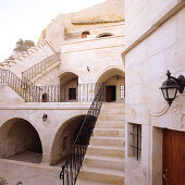 Oriental palace with terrace and stairs leading down to courtyard