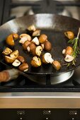 Fried brown mushrooms in a pan