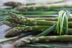 Fresh green asparagus tied with chives