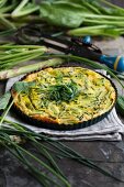 Egg cake with green asparagus and chives
