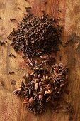 Cloves and star anise on a wooden surface