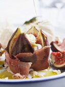 Stuffed figs with yogurt cheese wrapped in ham