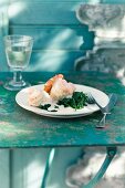 Sole fillets with white wine sauce and spinach