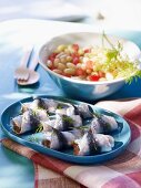 Sardine rolls with a bean and tomato salad