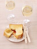 Croque monsieur with chorizo and two glasses of white wine