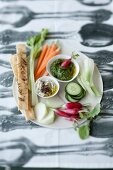 Raw vegetables with two dips and focaccia bread
