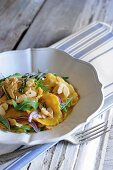 Pumpkin ravioli with fresh herbs and butter sauce