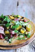Pumpkin salad with beef and cress