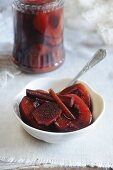 Spiced plums in red wine
