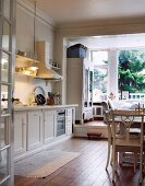 Dining area in country house kitchen with view of garden