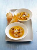 Cold pineapple and passion fruit soup with lychees