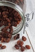 Raisins falling out of a jar