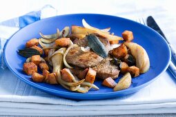 Pork chops with pears and diced potatoes