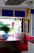 Sitting area with table in the living room of a holiday home