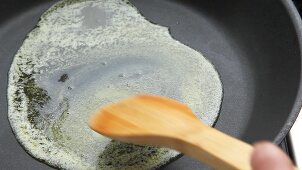 Melting butter in a frying pan