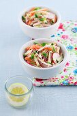 Carrot and courgette salad with radishes, bean sprouts, mayonnaise and mint