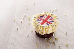 A cupcake topped with cream and a Union Jack