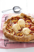 Nectarine and almond tart with vanilla ice cream