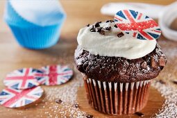 Chocolate cupcake topped with cream and a Union Jack