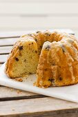 A Bundt cake with dark and white chocolate