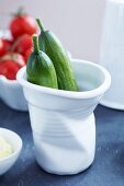 Mini cucumber in a porcelain cup