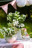 Flower arrangements on garden table
