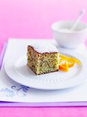 A slice of orange and poppyseed cake