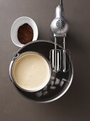 Parfait mixture being mixed in a cold bain marie with pumpernickel bread