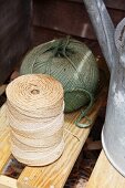 A watering can and rolls of twine